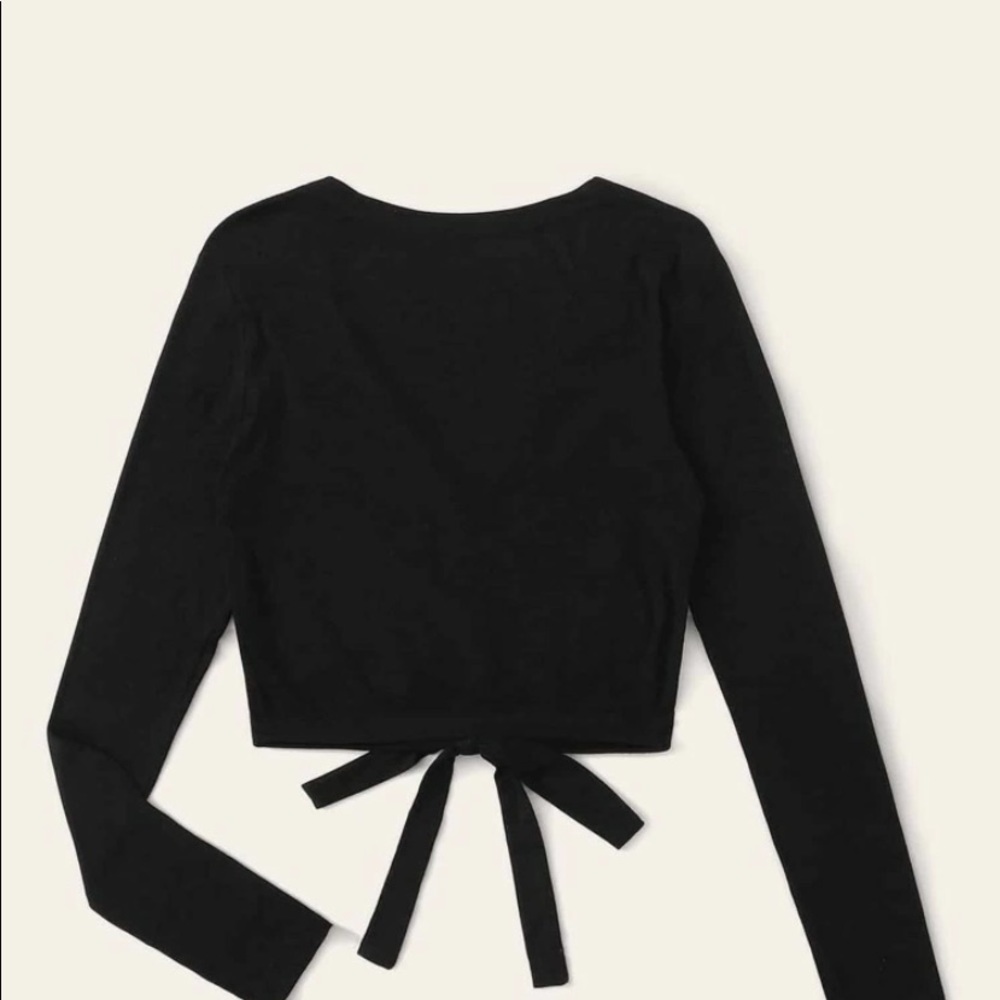 A black long sleeve tied crop top